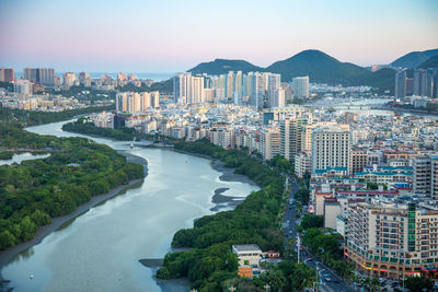 High angle view of buildings in city against sky