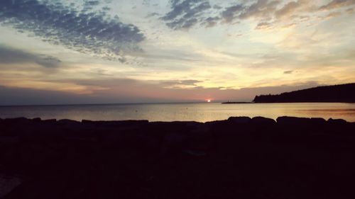 Scenic view of sea against sky at sunset