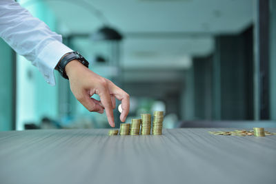 Close-up of hand on table