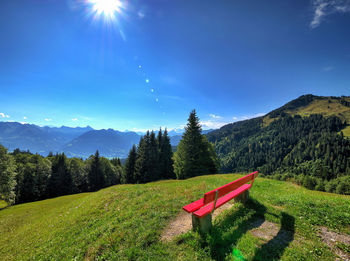 Scenic view of landscape against blue sky