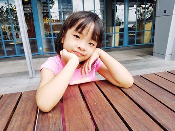 Girl sitting outdoors