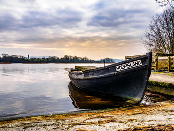 Boat on beach against sky