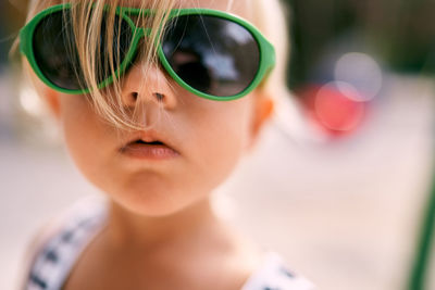 Portrait of girl wearing sunglasses