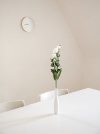 Close-up of alarm clock on table