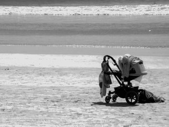 Baby carriage on beach