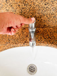 Close-up of hand holding water