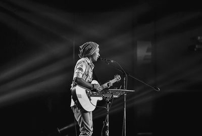 Low angle view of man playing guitar