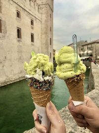 Midsection of person holding ice cream