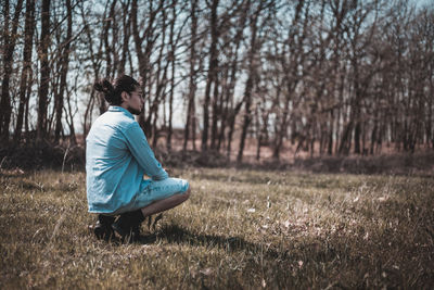 Side view of woman on field