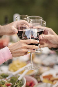 Midsection of woman drinking glass