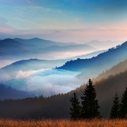 Scenic view of mountains against sky during sunset