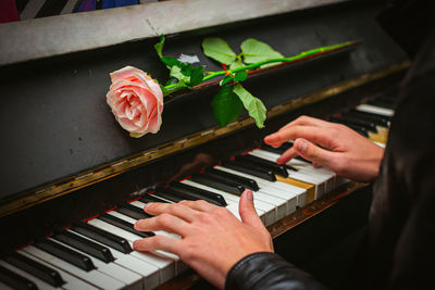 The hands of a street musician playing the piano