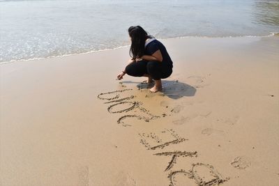 Full length of woman on beach