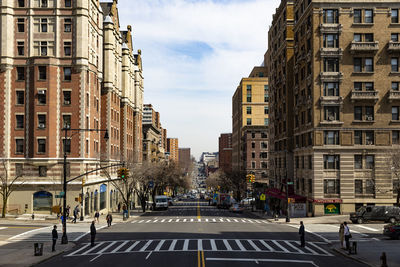 City street against cloudy sky