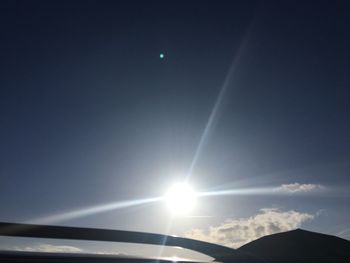 Low angle view of sun in sky