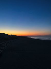 Scenic view of sea against clear sky during sunset