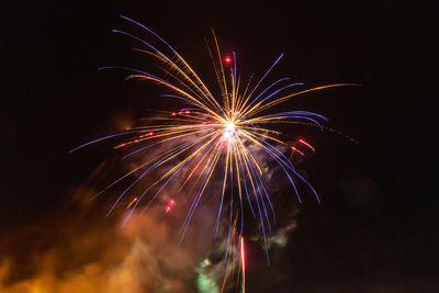 Long exposure of fireworks in the sky.