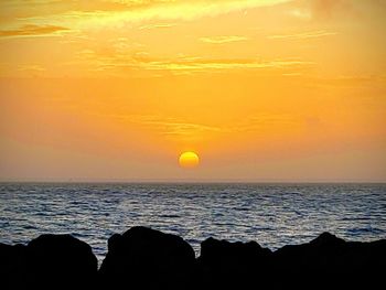 Scenic view of sunset over sea