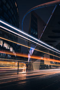 High angle view of light trails on road at night