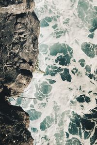 High angle view of rock formation in sea