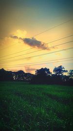 Scenic view of field against sky during sunset