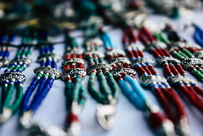 High angle view of multi colored bracelets at market stall