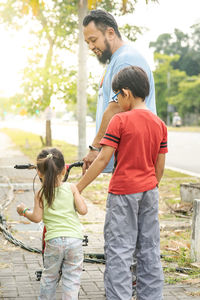 Full length of father with daughter