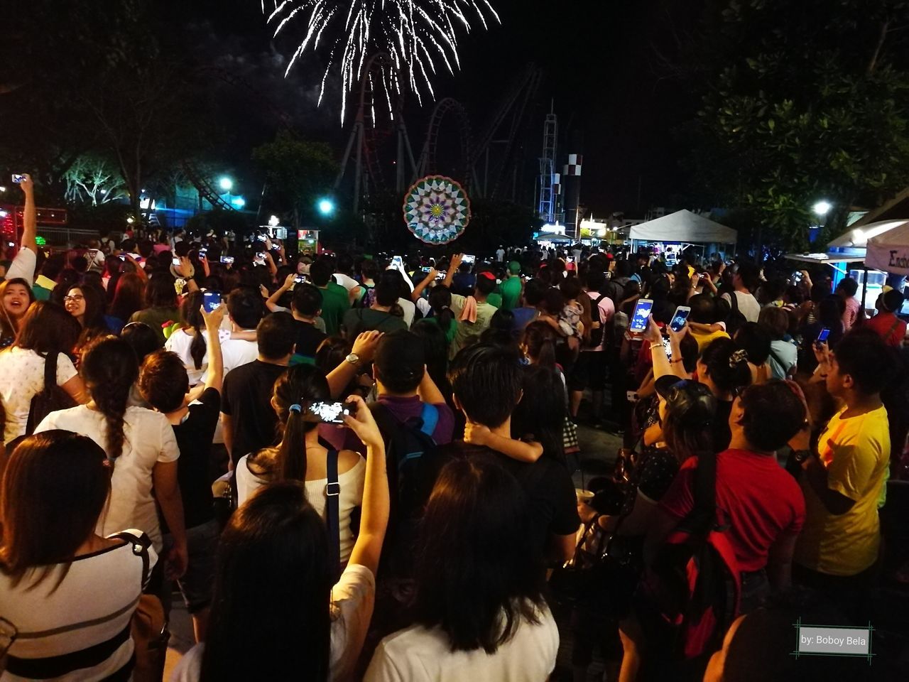 CROWD AT ILLUMINATED MARKET