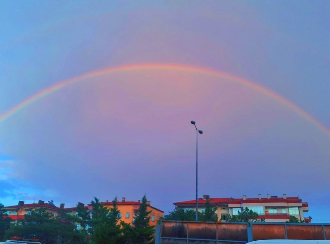 rainbow, sky, architecture, building exterior, built structure, building, nature, beauty in nature, multi colored, no people, scenics - nature, residential district, city, cloud - sky, plant, house, low angle view, day, tree, outdoors, double rainbow