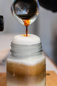 Close-up of coffee in glass on table