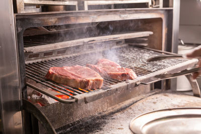 Close-up of meat on barbecue grill