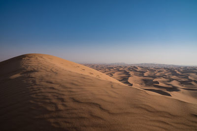 Scenic view of desert against clear sky