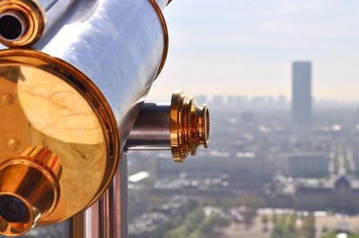 Close-up of coin-operated binoculars on sunny day