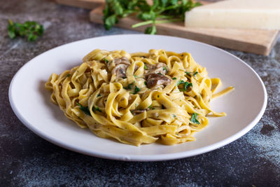 Italian fettuccine pasta with porcini mushrooms. italian pasta. vegetarian dish.