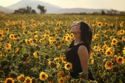 Woman standing in field