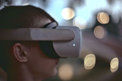 Rear view of boy wearing vr headset