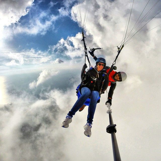 sky, leisure activity, lifestyles, cloud - sky, low angle view, childhood, full length, boys, men, cloudy, fun, enjoyment, togetherness, casual clothing, cloud, elementary age, sport, day