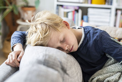 Boy sleeping on sofa