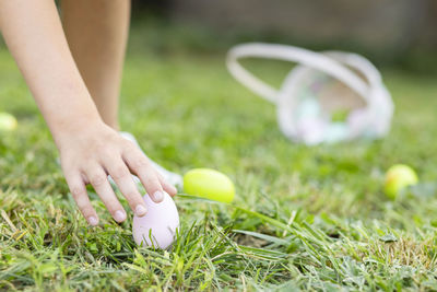 Midsection of woman playing golf