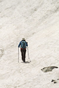 Rear view of woman in snow