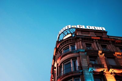 Low angle view of building against clear blue sky