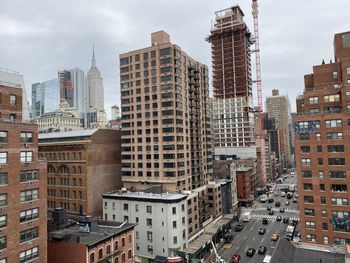 Modern buildings in city against sky