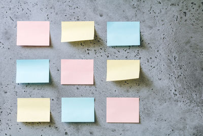 Colorful blank adhesive notes on wall