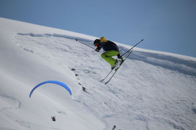 Person skiing on snowcapped mountain