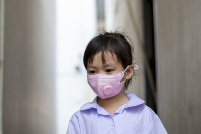 Portrait of girl wearing mask