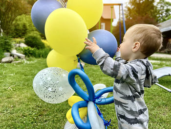 Boy playing with balloons