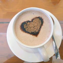 High angle view of cappuccino on table