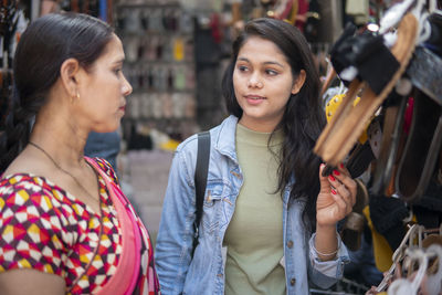 Young woman looking at store