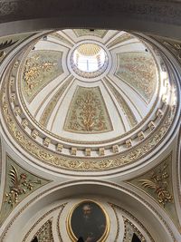 Directly below shot of ceiling of historic building