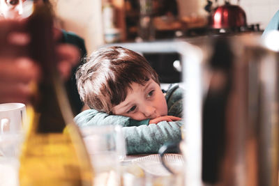 Portrait of boy looking at table